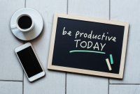 A chalkboard with "be productive today" written in chalk