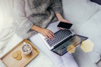 Image of woman relaxing while on laptop