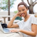 Smiling woman with laptop