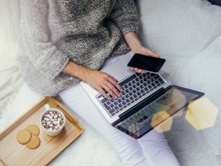 Image of woman relaxing while on laptop